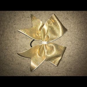 Gold cheer bow.